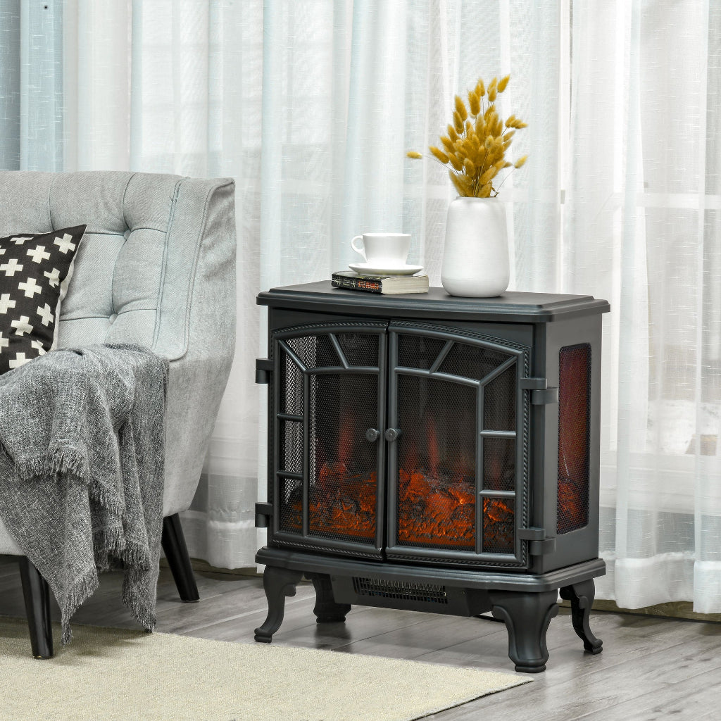 Electric fireplace heater in a living room setting with a couch and decorative items.